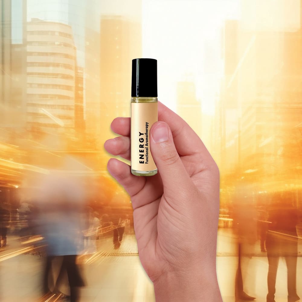 Man holding Energy Natural Aromatherapy Roller in busy London city | Awake Organics